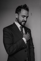 Groom cleaning his shoes for his wedding