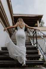 Groom coming out of bathing and putting on his suit for his wedding