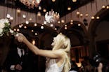 Groom and bride holding hands at their wedding