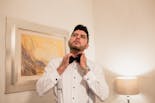 Groom shaving his beard for his wedding