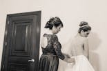 Groom coming out of bathing and putting on his suit for his wedding