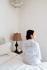 Groom coming out of bathing and putting on his suit for his wedding