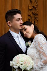 Groom and bride hugging and smiling
