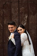 Groom and bride hugging and smiling