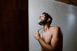 Groom shaving his beard for his wedding