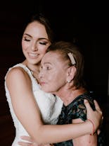 The bride hugging her grandmother on her wedding day