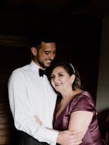 Mother and son smiling hugging before the wedding