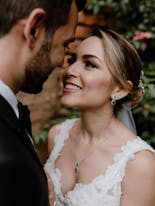 Groom and bride hugging and smiling