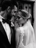 Groom and bride together and smiling at their wedding