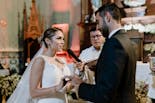 Wife putting the ring on her husband