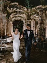 Groom and bride walking at night at Hacienda Santa Lucia