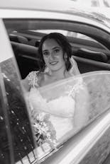 Groom peeking out the window at his wedding